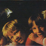 Amber, Josh, Brant and Katie piled up in front of the fire at camp. 