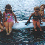 Brant, Amberm Katie and Josh on the Wind Surfing board. The sail hardly got used, but it was a great dock to play on. 