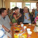 Papa enjoying a luau with grandchildren at Garden View! Great food, fun, and most important family!