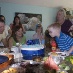 Pa helping Ethan blow out candles 2009
