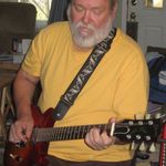 Dad playing his guitar. He loved his music and it was a large part of his life.