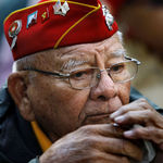 In this Nov. 11, 2011 photo, Keith Little, 87, from Winter Rock, Az., a veteran Navajo CodeTalker with the U.S. Marine Corp 4th Marine Division 25th Regiment between 1939- 1945, listens during ceremonies for the New York City Veterans Day Parade. Keith Little