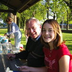 enjoying a family picnic with one of his granddaughters