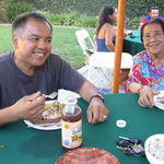 Grandma and dad at a family summer barbecue