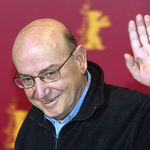 Greek movie director Theo Angelopoulos waves during a photocall prior to a press conference about his film "Trilogy: The Weeping Meadow" at the 54th Berlinale international film festival in Berlin on Thursday, Feb. 12, 2004. Theo Angelopoulos