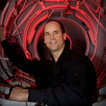 Steve Appleton, CEO and chairman of Micron Technology Inc., looks out through the engine compartment of his stunt jet airplane inside the hanger where he keeps several different types of aircraft in Boise, Idaho, Dec. 12, 2005. Steve Appleton