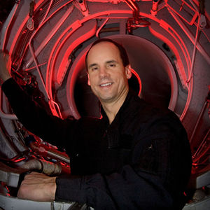 Steve Appleton, CEO and chairman of Micron Technology Inc., looks out through the engine compartment of his stunt jet airplane inside the hanger where he keeps several different types of aircraft in Boise, Idaho, Dec. 12, 2005. 