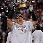 In this Jan. 20, 2008, file photo, New England Patriots linebacker Junior Seau holds the Lamar Hunt Trophy looks on after defeating the San Diego Chargers 21-12 in the AFC Championship NFL football game in Foxborough, Mass.