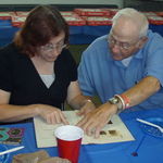 2009 Lawrence and Linda viewing the family tree.