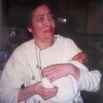 Proud grandma! Leslie holding first grandchild, Brandon