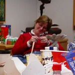 Elaine sings a snippet of "Jingle Bells" during a work Christmas party - year 2002