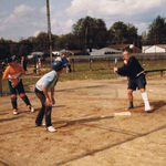 Bob is playing softball even after a car accident. Notice the cigar in his mouth too.