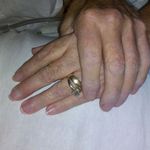 Bill put his wedding ring over mine,holding on.