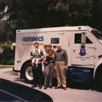 Burt Brink holding Tyler Brink, Steve Brink holding Brian Brink, and Larry Brink.