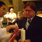 Lighting Abby's baptism candle as Abby's Godfather