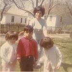 Nellie with her twin granddaughters, Stacy and Kim, and grandson Ben