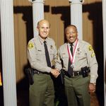 Awarded Medal of Valor in 2001 (pictured with Sheriff Baca)