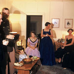  A wonderful dinner party at the McDaniel's quarters.  The hot looking woman in the black dress sitting on the chair arm is Rachel, Mac's wife.  She looks good, real good. Kansas  Anyone know where the horse prints are?
