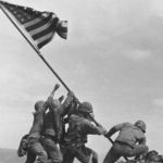 US marines raising the American flag atop Mt Suribachi in Iwo Jima, Japan, in 1945. Alan Wood