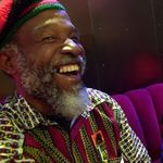 FILE - In this June 7, 2001 file photo, Jamaican musician Cedric Brooks, left, laughs next to Ska pioneer Johnny "Dizzy" Moore as they talk about their days at the Alpha Boys School in Kingston, Jamaica at the Experience Music Project in Seattle, Washington. One of Brooks' sisters, Paulette Keise, said he died Friday, May 3, 2013 of cardiac arrest at New York Hospital Queens. He was 70. Brooks began his music career in the late 1960s as a studio musician, playing in songs such as Burning Spear's "Door Peep." He also had hits with trumpet player David Madden including "Money Maker" and "Mystic Mood." Brooks also was a member of the Jamaican ska band The Skatalites. Cedric Brooks