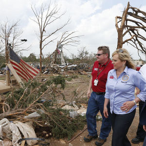 Oklahoma Gov. Mary Fallin, right, walks through the Steelman Estates Mobile Home Park, which was hard hit in Sunday's tornado, with Albert Ashwood, left, Director of the Oklahoma Department of Emergency Management, near Shawnee, Okla., Monday, May 20, 2013.