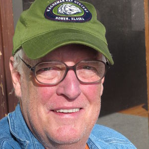In this Sept. 3, 2010 photo, Joe McGinniss, who is working on a book on former Alaska Gov. Sarah Palin, poses for a photograph at the home he's renting next to Palin's home in Wasilla, Alaska. Palin's neighbor of three months on Wasilla's Lake Lucille, is packing his bags and notebooks and leaving Sunday for his home in Massachusetts to write the book he has been researching on the former governor and GOP vice presidential candidate.