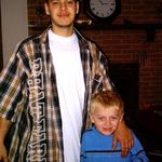 This is a semi-recent one I have of rob...pictured here with our cousin Erin about 4 years ago. He grew from that goofy little hyper boy to a handsome young man. I love you so much Rob!!