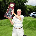 John holding the 2008 Nation Championship trophy at last year's Pike's Peak golf tournament.