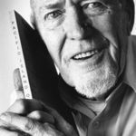 Carl Thien poses with his book 'Pacific Island Odyssey' about his WWII service in the Pacific.  The photo was taken in Australia for a news article on him in 1993