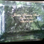 The urn of Janice's cremains, which are in a mausoleum in Apopka, Florida, where her parents live. Green was her favorite color.