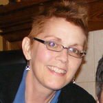 LAURA E. NEUMANN
