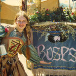 Sandy at the Northern Renaissance Faire with banner she created for Yvonne's Roses