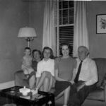 Eva's mother Maggie, sister Annette, Eva and her father at the front room of their house in Nashville (May, 1959)