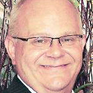 LARRY E. MINOTT
