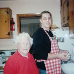 Oma with her Grandaughters husband Travis, showing him a view things in the Kitchen.