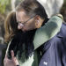 Msgr. Lloyd Torgerson embraces an unidentified parishioner after a special prayer for two members, Jean and Scott Adam, and their two companions, all slain by Somali pirates who seized their yacht off East Africa, at morning Mass at St. Monica's Roman Catholic Church in Santa Monica, CA.