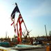 A torn American flag stands in the wreckage of a church in Joplin, Mo., Tuesday, May 24, 2011. Rescue crews worked through the rain-soaked chill of night, ignoring lightning and strong winds to dig through splintered homes, crumpled businesses and crushed cars in Joplin. 