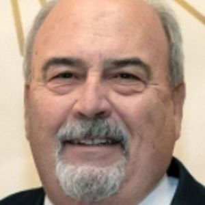 THOMAS E. "TOM" MILLER